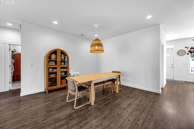 dining space with recessed lighting, dark wood finished floors, visible vents, and baseboards