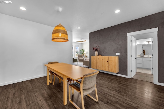 dining space featuring recessed lighting, baseboards, and dark wood-style flooring