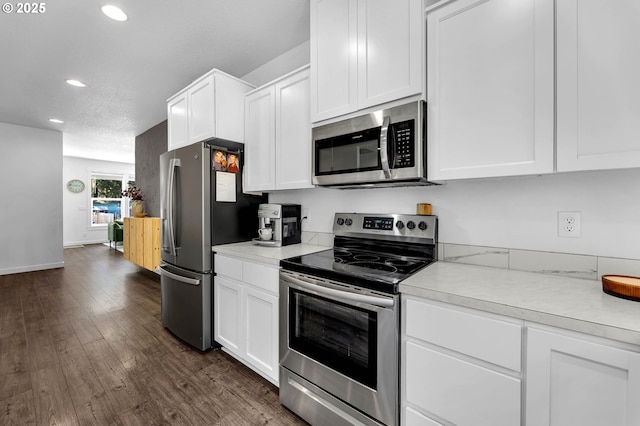 kitchen with light countertops, recessed lighting, white cabinetry, and appliances with stainless steel finishes