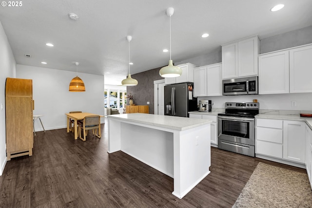 kitchen with stainless steel appliances, dark wood-style floors, and recessed lighting