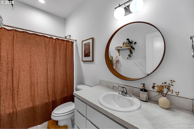 bathroom with toilet and vanity