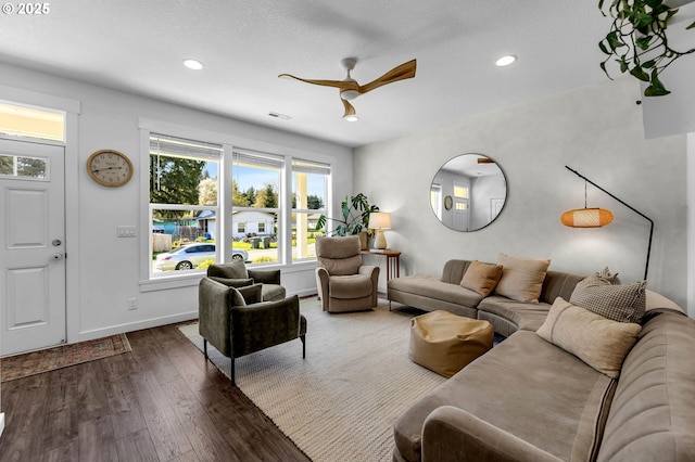 living room with visible vents, a ceiling fan, wood finished floors, and recessed lighting