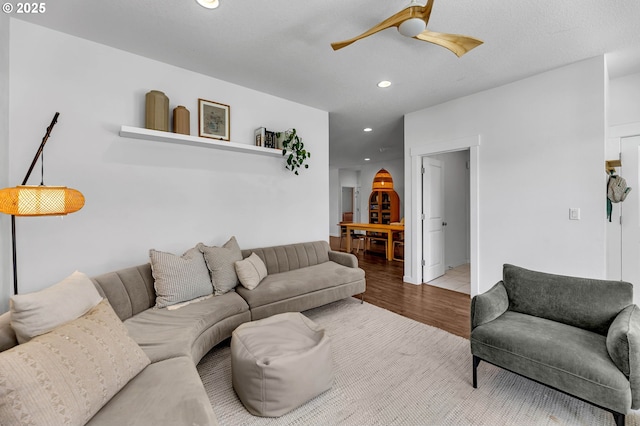 living room featuring recessed lighting, wood finished floors, and a ceiling fan