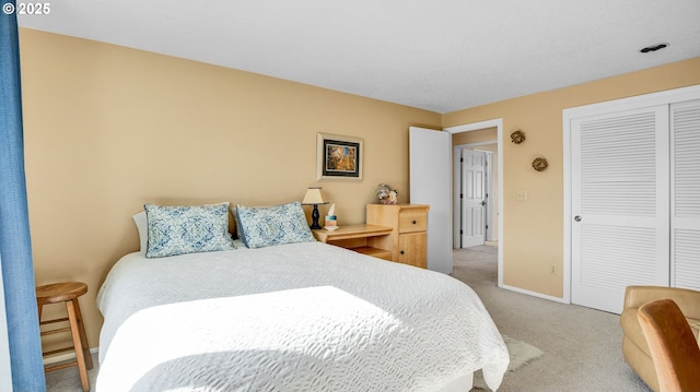 bedroom featuring carpet floors, a closet, and baseboards