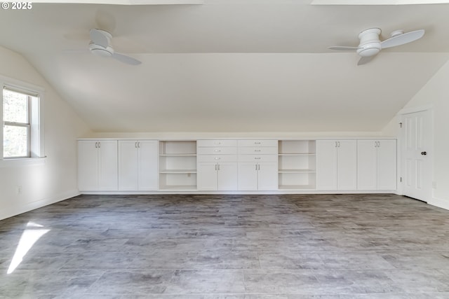 bonus room with ceiling fan and vaulted ceiling