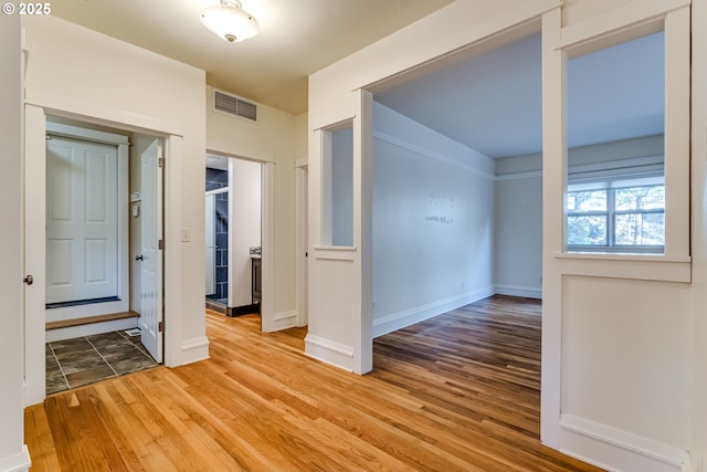 empty room featuring hardwood / wood-style flooring