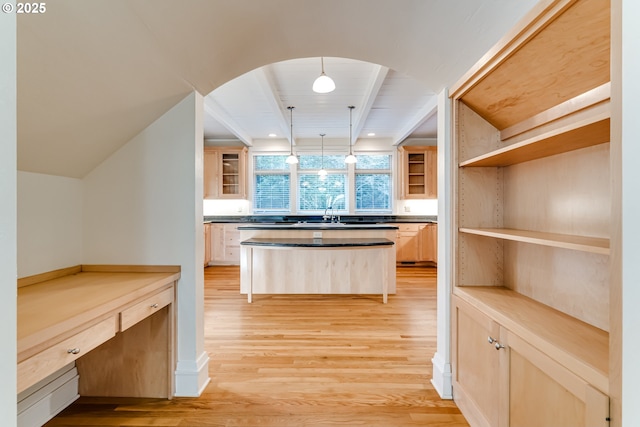 kitchen featuring wooden counters, hanging light fixtures, light hardwood / wood-style floors, beamed ceiling, and light brown cabinets