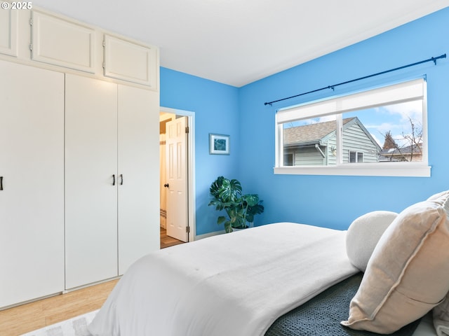 bedroom with light hardwood / wood-style flooring