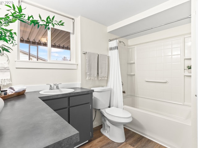 full bathroom with wood-type flooring, shower / bath combo, vanity, and toilet