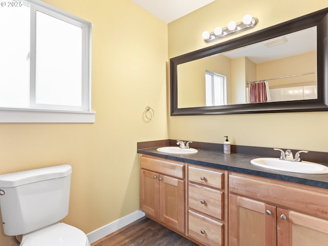 bathroom featuring vanity, a shower with curtain, wood-type flooring, and toilet