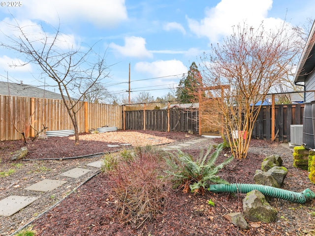 view of yard with central AC