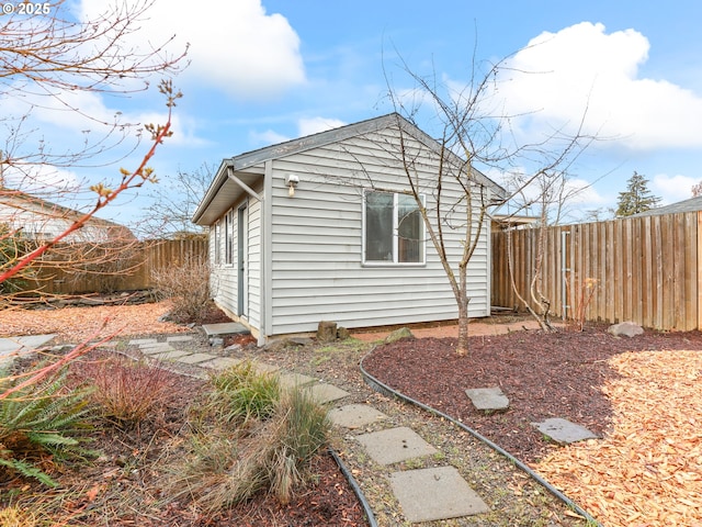 view of side of home with an outbuilding