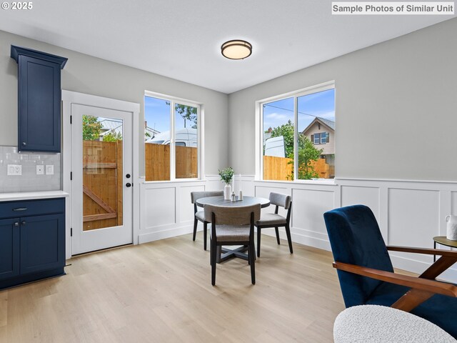 4585 N Haight Ave, Portland, OR 97217 - kitchen featuring appliances with stainless steel finishes, blue cabinets, light countertops, light wood finished floors, and recessed lighting
