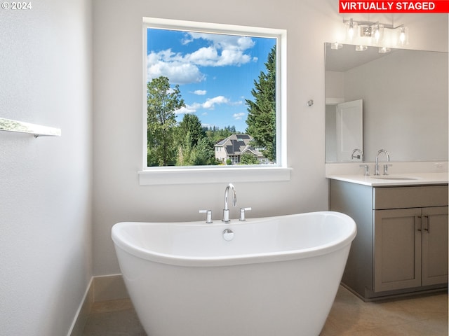 13906 SW 165th Ave, Tigard, OR 97223 - full bathroom featuring a freestanding bath and vanity