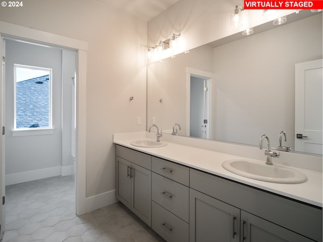 13906 SW 165th Ave, Tigard, OR 97223 - full bath featuring double vanity, baseboards, and tile patterned flooring