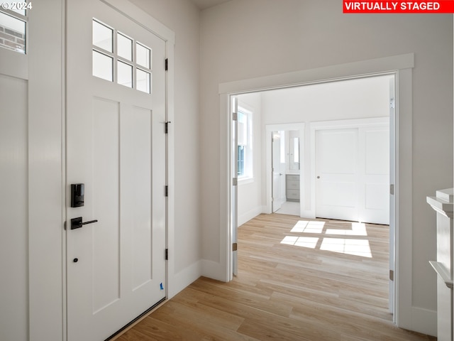 13906 SW 165th Ave, Tigard, OR 97223 - entryway featuring light wood-style flooring and baseboards