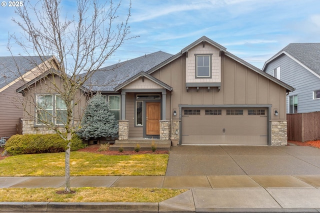 view of front of house with a garage and a front lawn