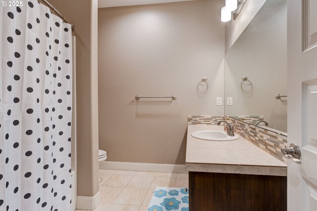 bathroom with vanity, backsplash, tile patterned floors, and walk in shower