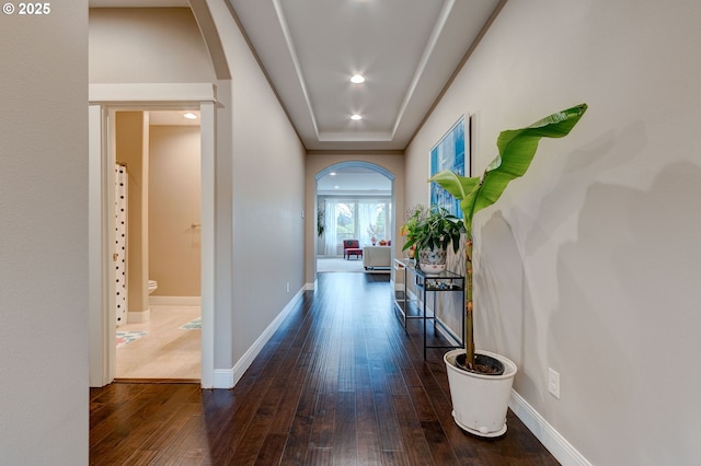 hall with dark hardwood / wood-style floors