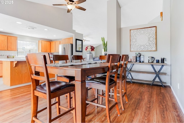 4870 Dorrance Loop NE, Salem, OR 97305 - dining space with ceiling fan, light wood-style flooring, and high vaulted ceiling