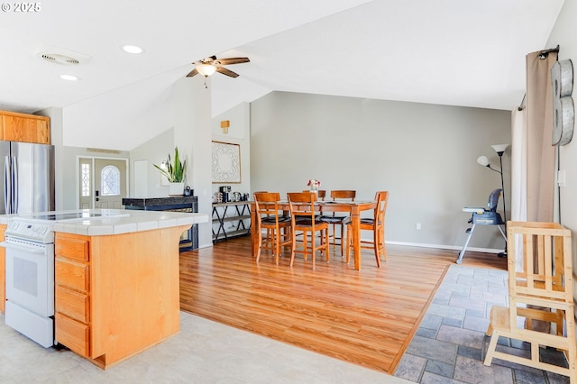4870 Dorrance Loop NE, Salem, OR 97305 - kitchen with tile countertops, white electric stove, a ceiling fan, light wood-type flooring, and lofted ceiling
