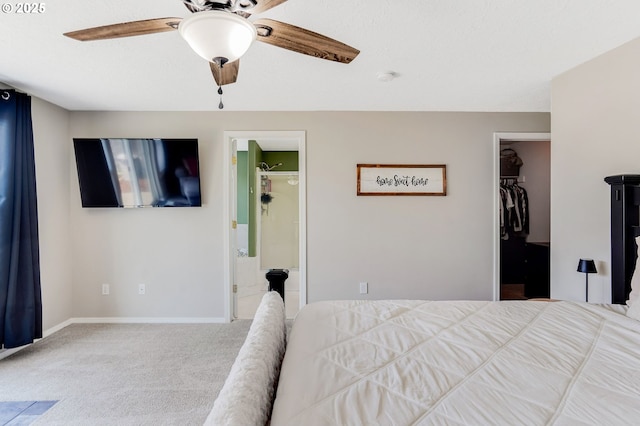 4870 Dorrance Loop NE, Salem, OR 97305 - carpeted bedroom with a walk in closet, a closet, a ceiling fan, and ensuite bath