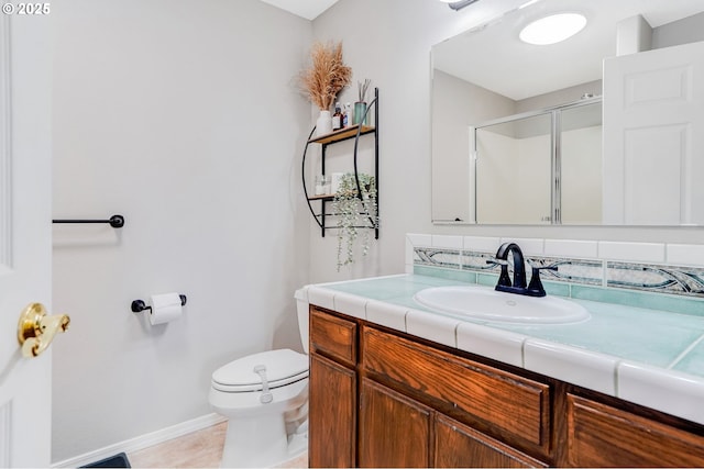 4870 Dorrance Loop NE, Salem, OR 97305 - bathroom with vanity, a shower with shower door, tile patterned flooring, and decorative backsplash