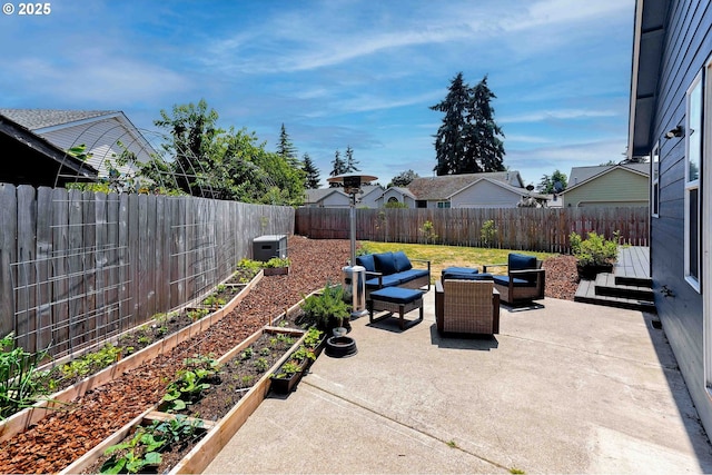 4870 Dorrance Loop NE, Salem, OR 97305 - fenced backyard featuring a vegetable garden, a patio area, and outdoor lounge area