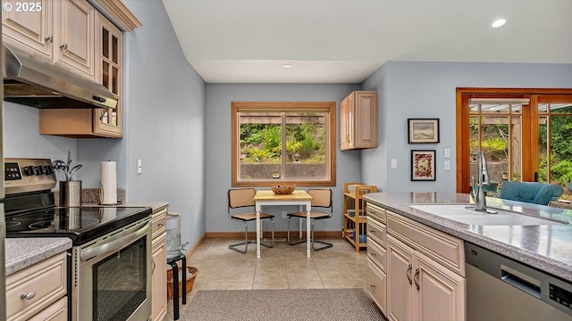35130 Ponderosa Loop, Manzanita, OR 97130 - kitchen featuring stainless steel appliances, under cabinet range hood, light tile patterned floors, light countertops, and recessed lighting