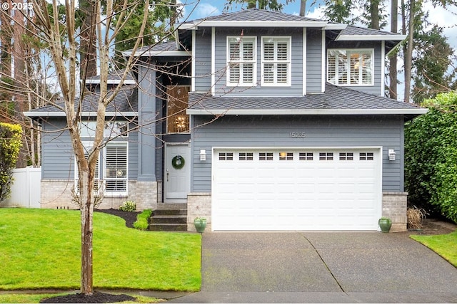 view of front of home with brick siding, fence, a garage, driveway, and a front lawn