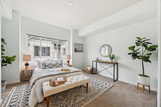 carpeted bedroom with baseboards