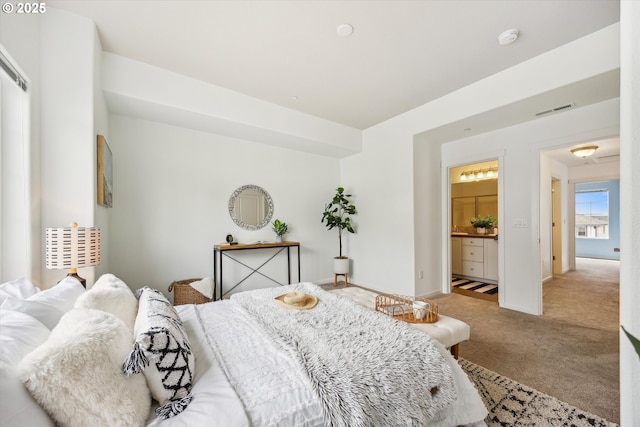 carpeted bedroom featuring baseboards