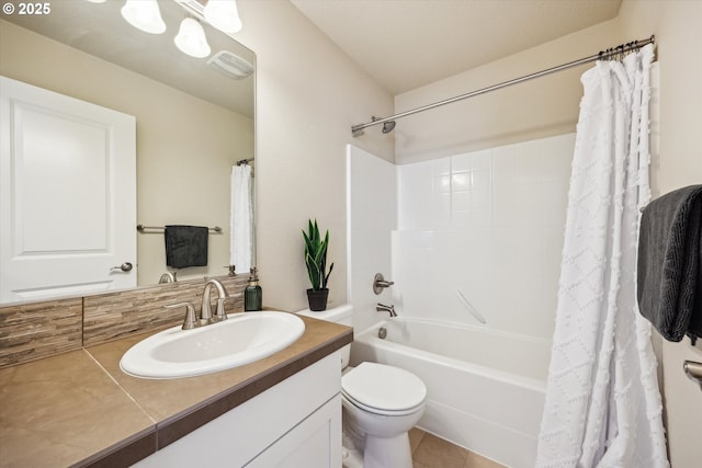 bathroom with vanity, toilet, shower / tub combo with curtain, and tile patterned flooring