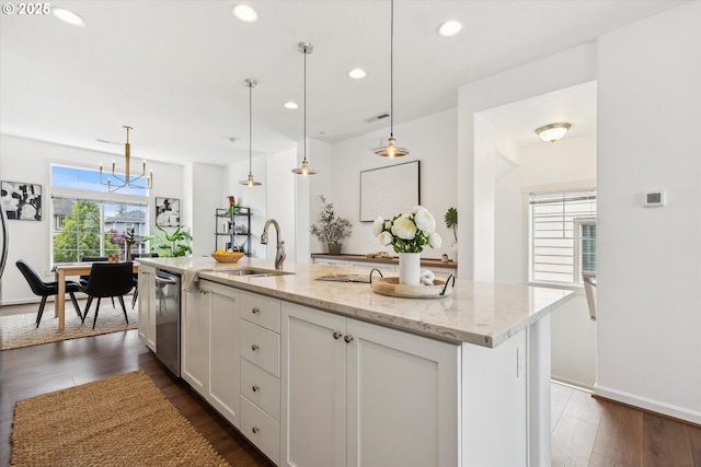 kitchen with a sink, dishwasher, white cabinets, light stone countertops, and recessed lighting