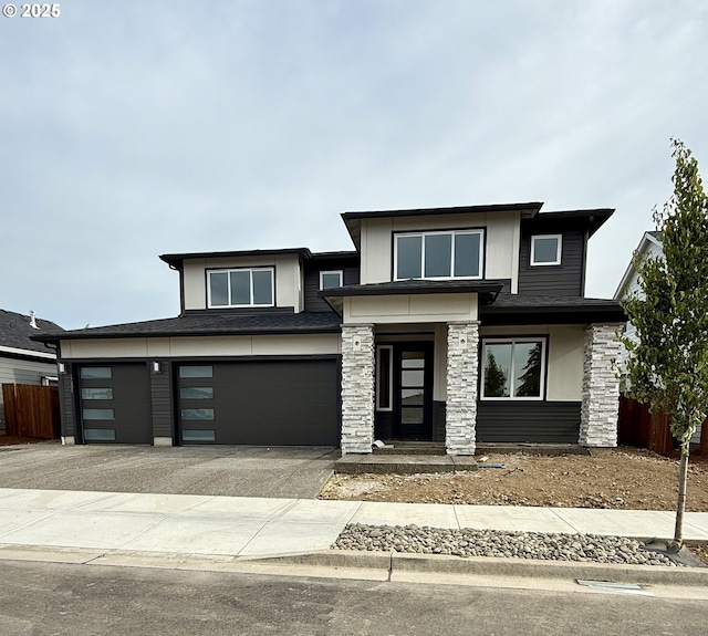 17205 NE 83rd St, Vancouver, WA 98682 - prairie-style home with stone siding, driveway, and an attached garage