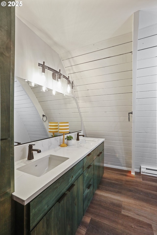 10056 Beach Dr, Birkenfeld, OR 97016 - bathroom featuring double vanity, wood finished floors, and lofted ceiling