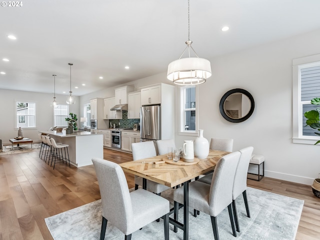 dining area featuring light wood-type flooring