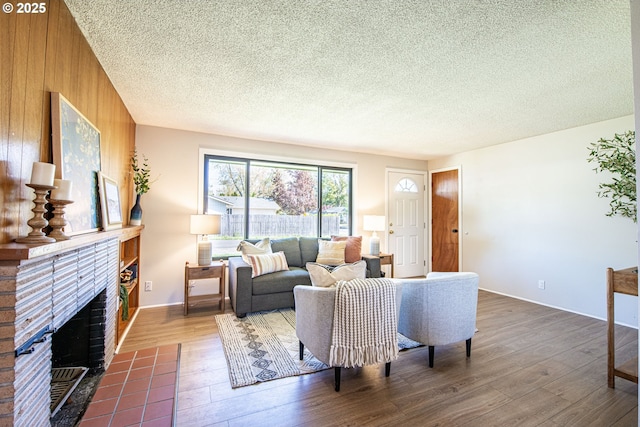 288 51st St, Springfield, OR 97478 - living room with a brick fireplace, dark wood-type flooring, and a textured ceiling