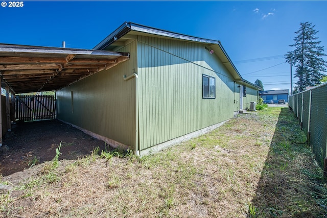 288 51st St, Springfield, OR 97478 - view of side of home featuring fence and a carport