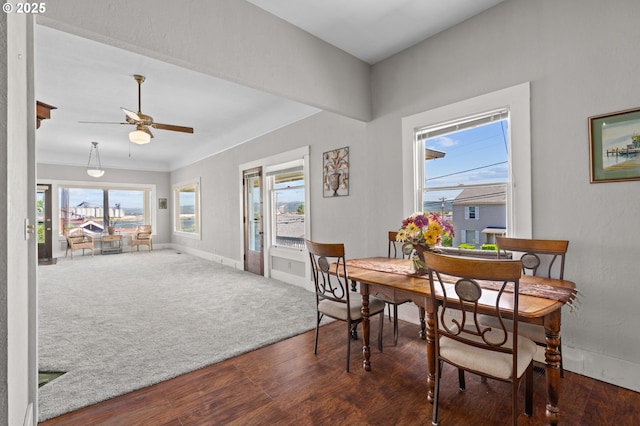 406 W C St, Rainier, OR 97048 - carpeted dining space featuring wood finished floors, a ceiling fan, and baseboards