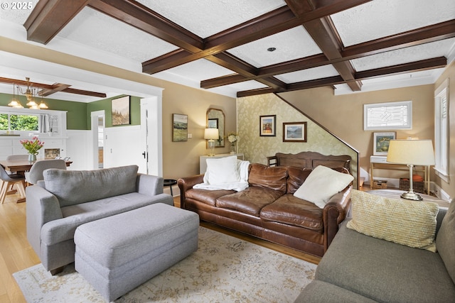 2006 SE 41st Ave, Portland, OR 97214 - living area with coffered ceiling, wood finished floors, a chandelier, beam ceiling, and baseboards