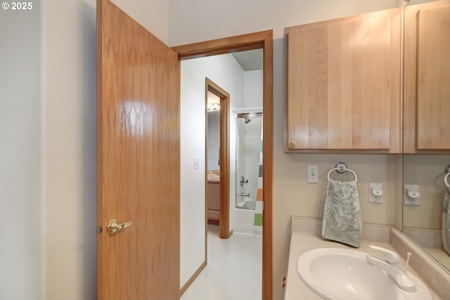 bathroom featuring vanity and baseboards