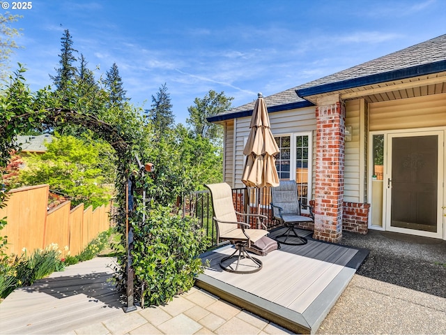 wooden deck featuring fence