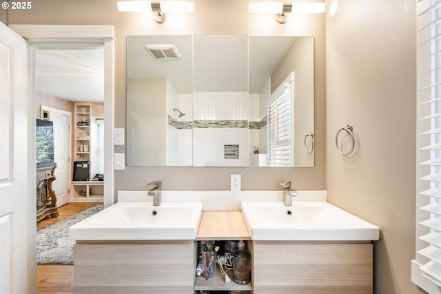 5200 SW Scholls Ferry Rd, Portland, OR 97225 - full bath featuring double vanity, wood finished floors, and a sink