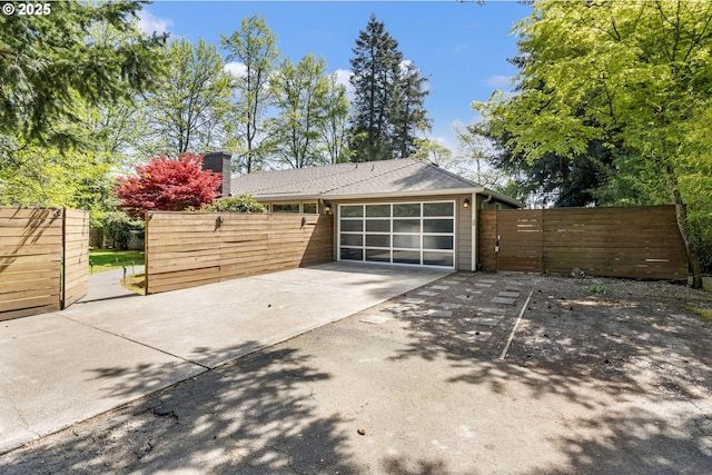 5200 SW Scholls Ferry Rd, Portland, OR 97225 - garage with a gate, fence, and concrete driveway