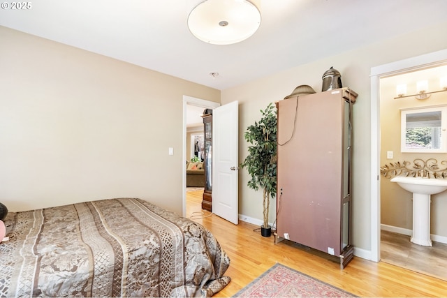 5200 SW Scholls Ferry Rd, Portland, OR 97225 - bedroom featuring baseboards and light wood-style flooring