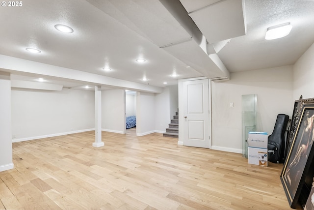 5200 SW Scholls Ferry Rd, Portland, OR 97225 - finished below grade area with recessed lighting, baseboards, stairway, and light wood-type flooring