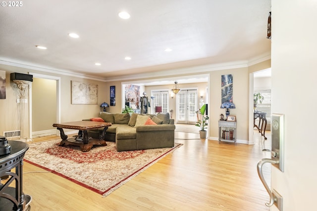 5200 SW Scholls Ferry Rd, Portland, OR 97225 - living area with crown molding, plenty of natural light, and light wood-style flooring