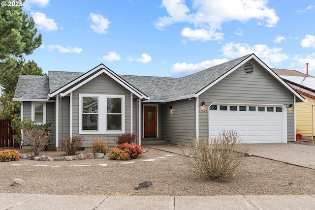 ranch-style home featuring driveway, a shingled roof, and a garage