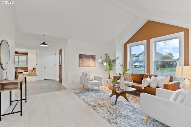 living room with baseboards, light colored carpet, and vaulted ceiling with beams